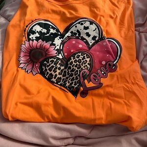 Vibrant Orange Short Sleeve Tee with Heart and Floral Design